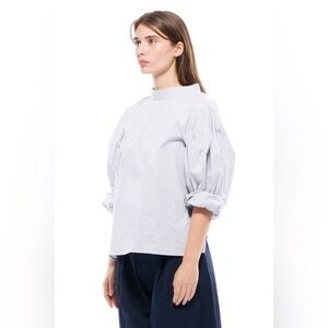 New with tags. Designer Toit Volant Chic balloon sleeve blouse. OS